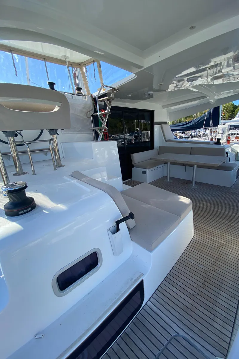 Slide: The Image of 2022 Lagoon 42 yacht with spacious deck and seating area. - 6