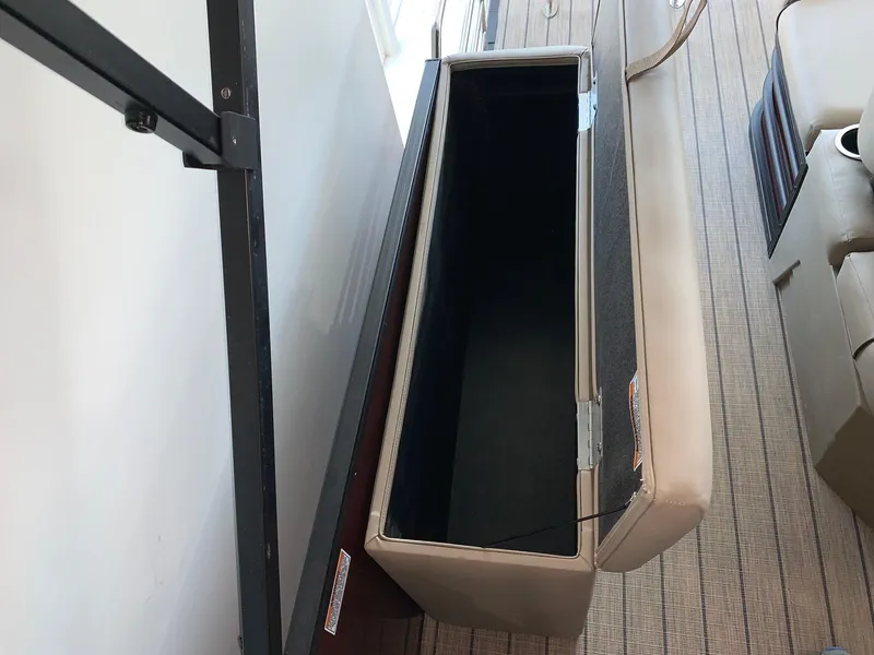 Slide: The Image of 2024 Starcraft SLS 3 Q DH boat storage compartment, open view. - 14