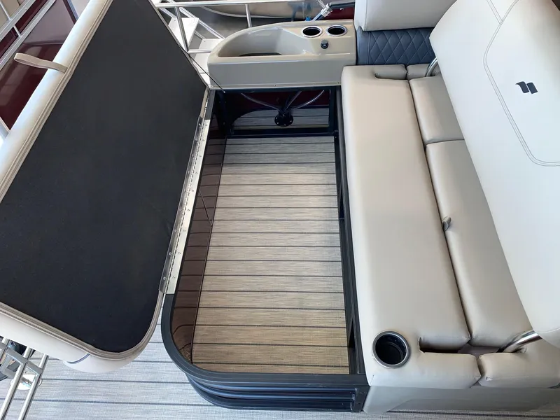 Slide: The Image of 2024 Starcraft SLS 3 Q DH boat interior with beige seating and storage compartment. - 4