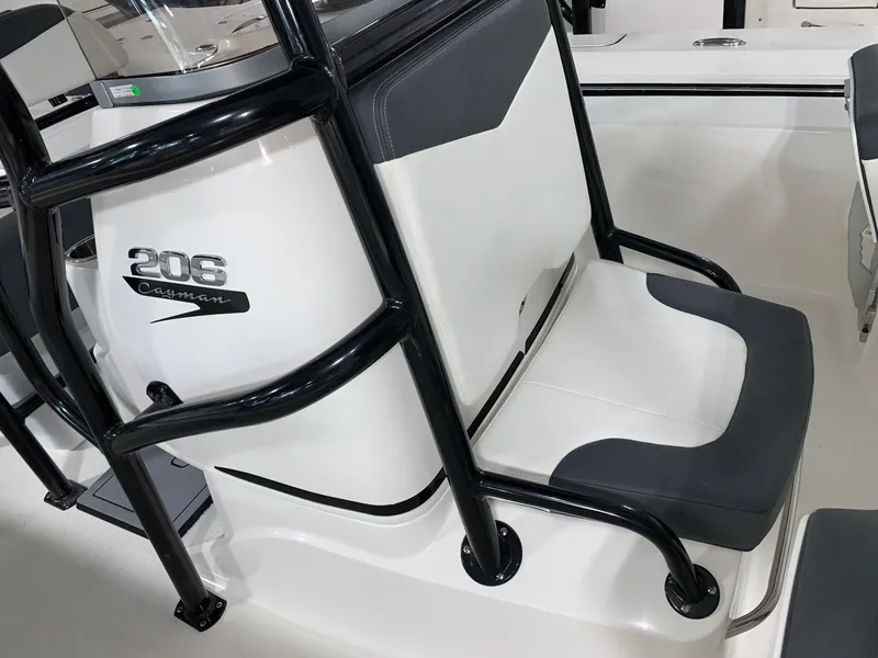 Slide: The Image of 2024 Robalo 206 Cayman boat seat with black frame and white upholstery. - 8