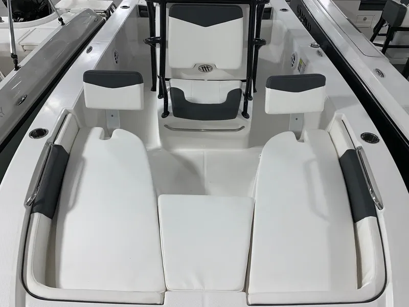 Slide: The Image of 2024 Robalo 206 Cayman boat interior with white and gray seating. - 11