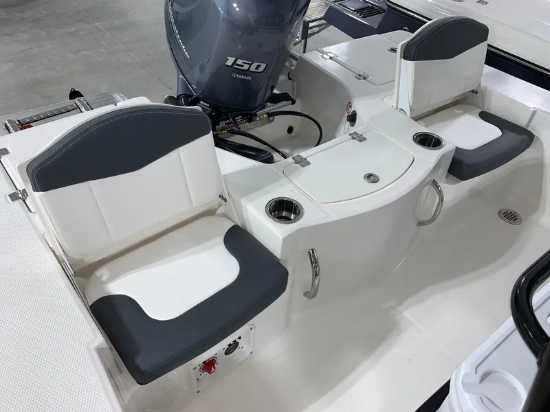 Slide: The Image of 2024 Robalo 206 Cayman boat interior with seating and Yamaha 150 engine. - 3
