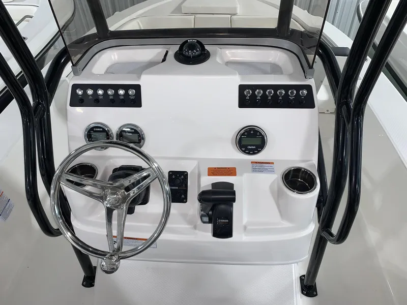 Slide: The Image of 2024 Robalo 206 Cayman boat console with steering wheel and control panel. - 5