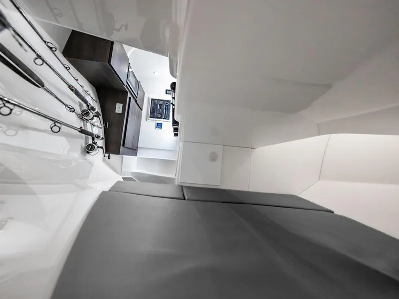 Slide: The Image of Interior of 2025 Albemarle 31DC boat with fishing rods and control panel. - 13