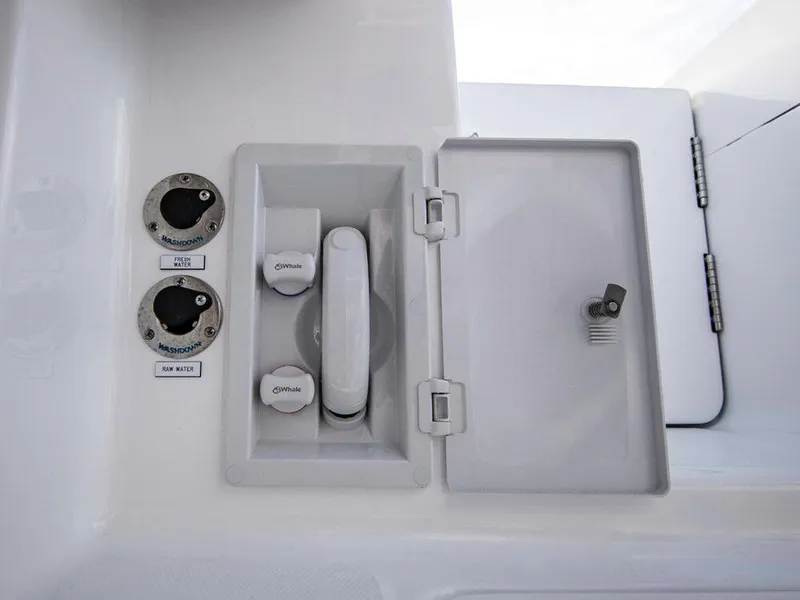 Slide: The Image of 2025 Albemarle 31DC boat fuel and water access panel. - 18