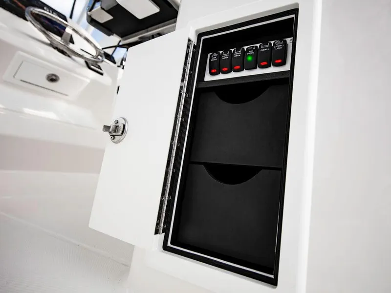 Slide: The Image of 2025 Albemarle 31DC control panel with open compartment. - 19