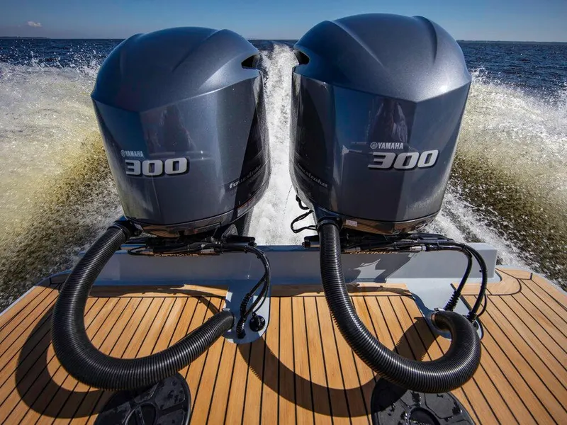 Slide: The Image of 2025 Albemarle 31DC with twin Yamaha 300 outboard engines on the water. - 7