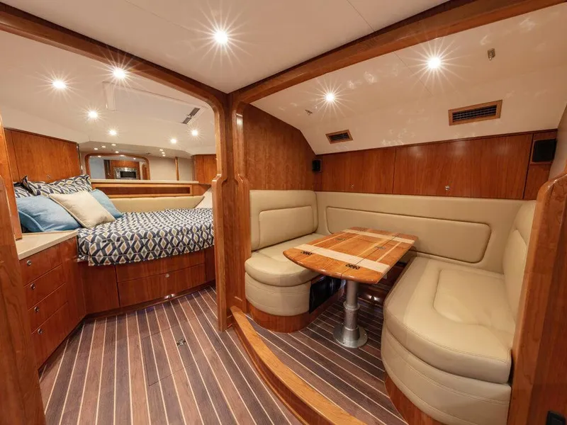 Slide: The Image of Luxurious interior of 2025 Albemarle 410 Express Fisherman with cozy seating and elegant wood finishes. - 10