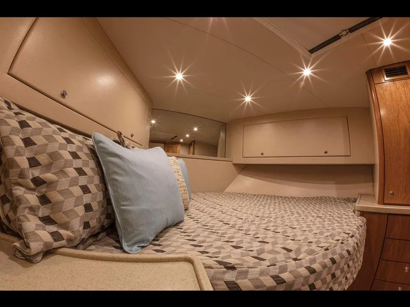 Slide: The Image of Luxurious cabin interior of 2025 Albemarle 410 Express Fisherman yacht with cozy bedding. - 15