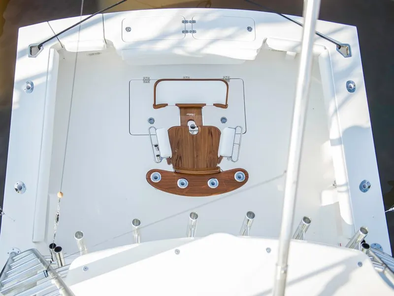 Slide: The Image of 2025 Albemarle 410 Express Fisherman boat deck with fishing chair. - 19