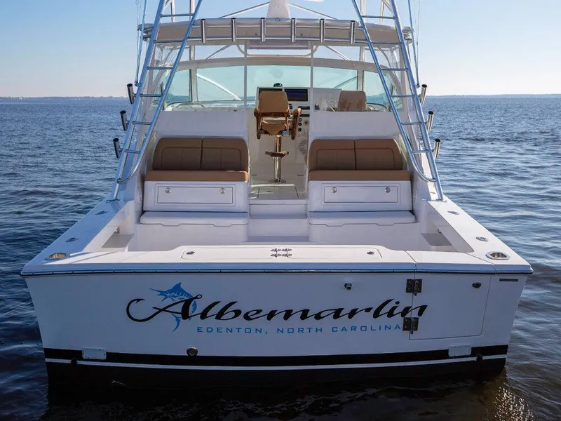 Slide: The Image of 2025 Albemarle 410 Express Fisherman boat on the water, rear view. - 2