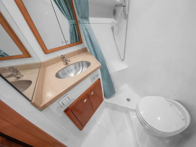 Slide: The Image of Modern bathroom in 2025 Albemarle 410 Express Fisherman boat with sink, toilet, and shower. - 20