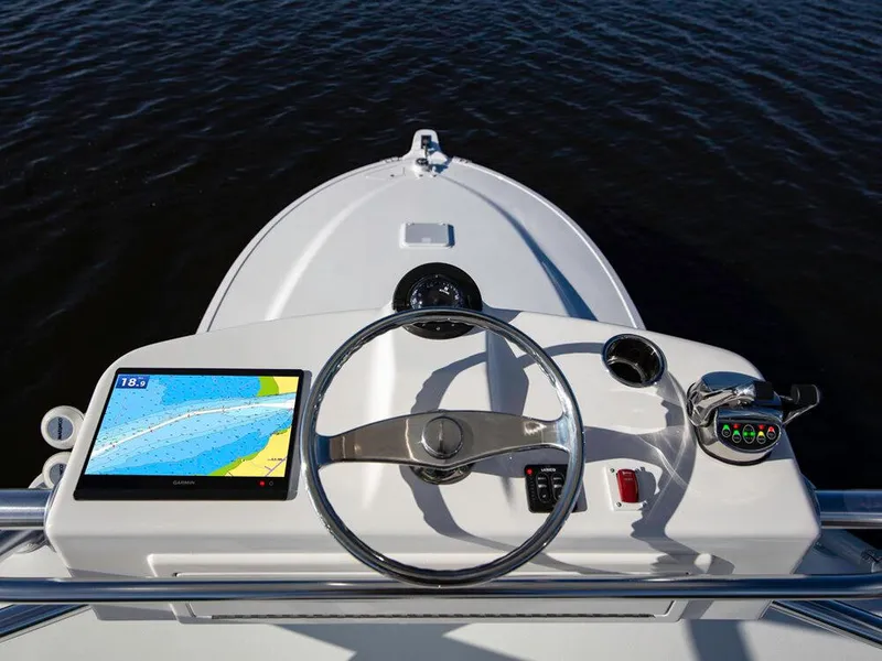Slide: The Image of 2025 Albemarle 410 Express Fisherman helm with navigation screen and controls. - 35