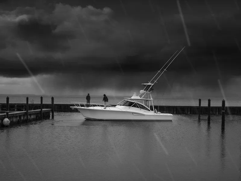 Slide: The Image of 2025 Albemarle 410 Express Fisherman in a stormy marina. - 37