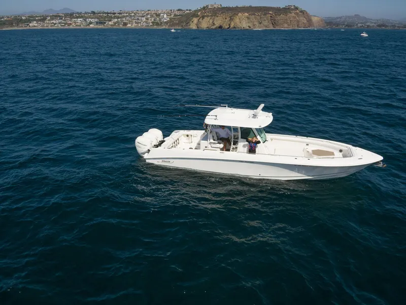The Image of 2016 Boston Whaler 350 Outrage on open sea near coastline. - 0