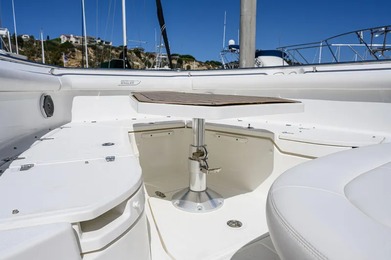 Slide: The Image of Interior of a 2016 Boston Whaler 350 Outrage boat with table. - 27