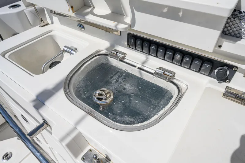 Slide: The Image of Boston Whaler 350 Outrage 2016, boat kitchenette with sink and controls. - 41