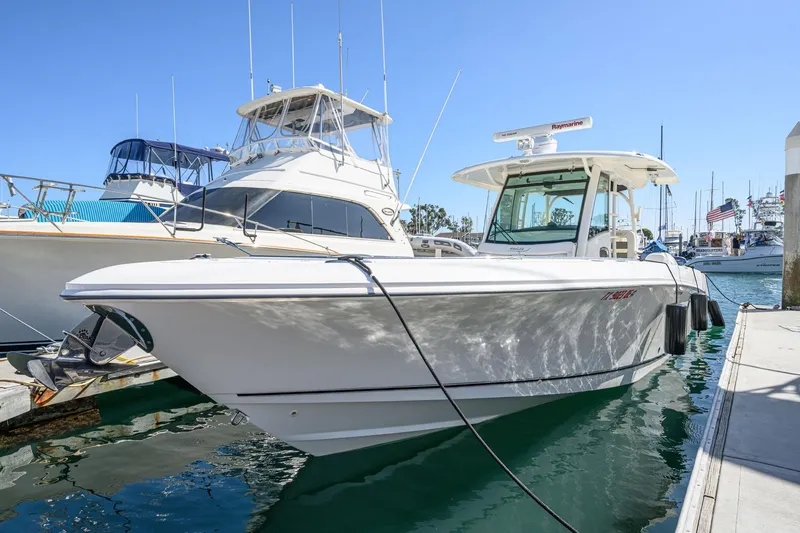 Slide: The Image of 2016 Boston Whaler 350 Outrage docked at marina. - 5