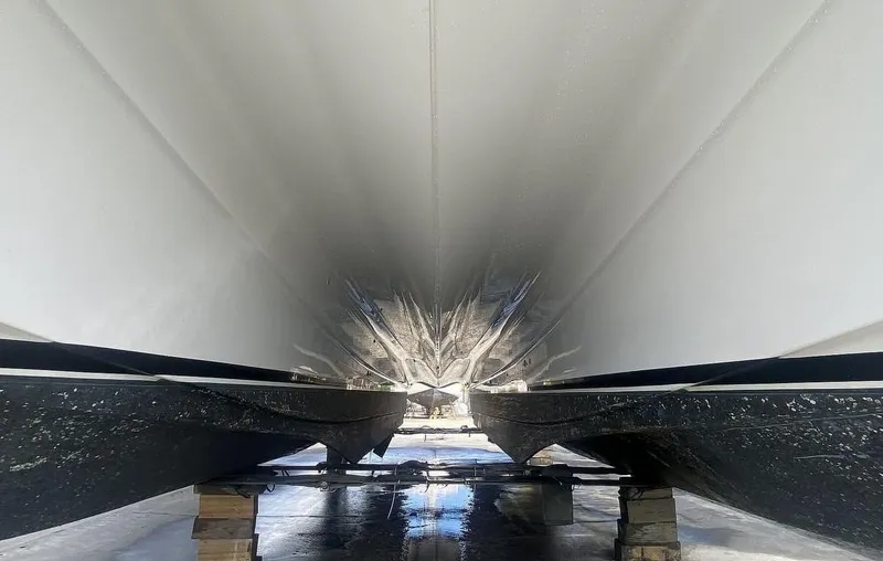 Slide: The Image of Underneath view of 2010 Custom Axcell Yachts 650 Power Catamaran hull on dry dock. - 14