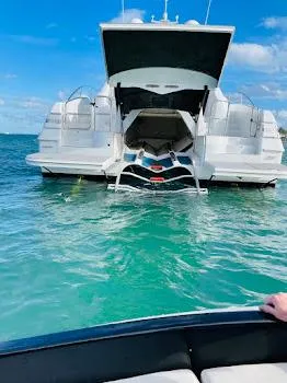 Slide: The Image of Custom Axcell Yachts 650 Power Catamaran, 2010, anchored in clear turquoise water. - 17