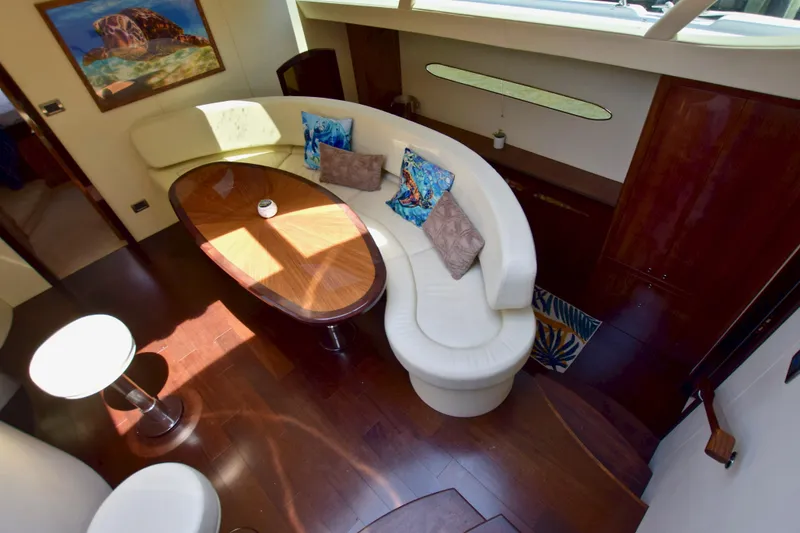 Slide: The Image of Luxurious interior of 2010 Axcell Yachts 650 Power Catamaran with elegant seating and wooden table. - 24