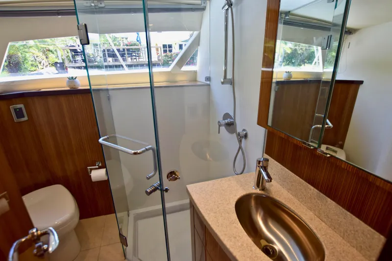 Slide: The Image of Luxurious bathroom in 2010 Axcell Yachts 650 Power Catamaran with modern fixtures and glass shower. - 26