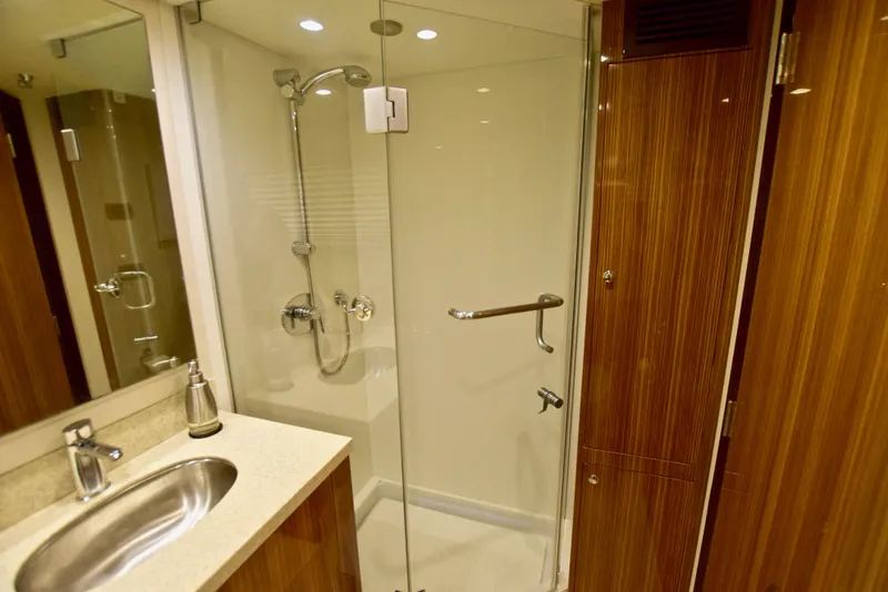 Slide: The Image of Luxurious bathroom in 2010 Axcell Yachts 650 Power Catamaran with glass shower and wood accents. - 28
