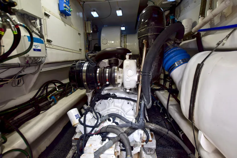 Slide: The Image of Engine room of 2010 Axcell Yachts 650 Power Catamaran, showcasing mechanical components and wiring. - 29