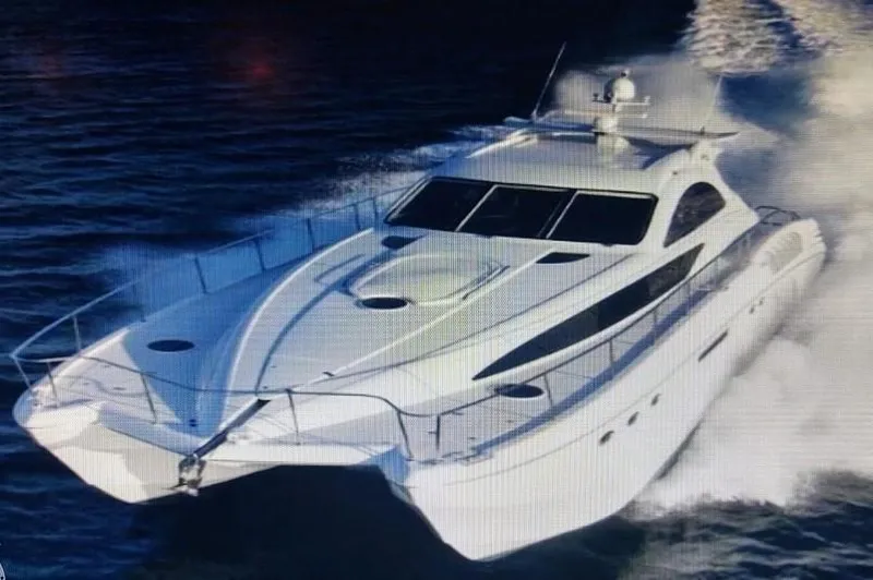 Slide: The Image of Custom Axcell Yachts 650 Power Catamaran cruising on water, 2010 model. - 3
