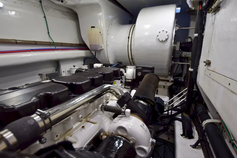 Slide: The Image of Engine room of 2010 Custom Axcell Yachts 650 Power Catamaran, showcasing machinery and components. - 33