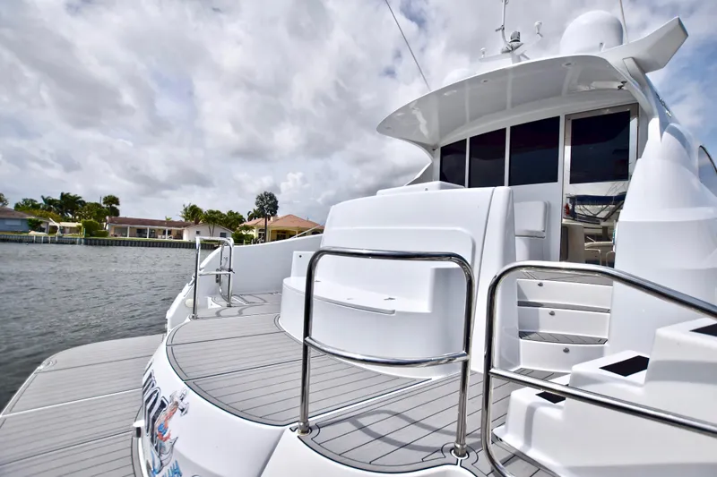 Slide: The Image of Luxurious 2010 Axcell Yachts 650 Power Catamaran docked by waterfront homes. - 36