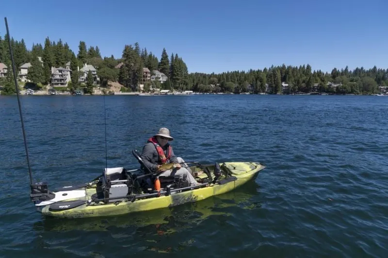 The Image of Angler fishing on a 2023 Hobie Mirage Pro Angler 12 kayak with 360 Drive Technology. - 0