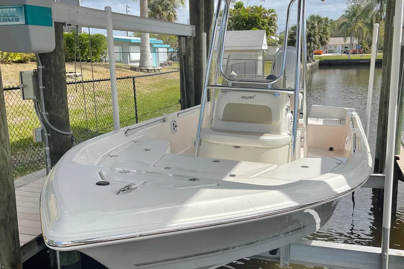 Slide: The Image of 2021 Bulls Bay 2000 boat docked on a lift in a canal. - 3