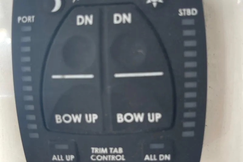 Slide: The Image of Bulls Bay 2000 2021 trim tab control panel with bow up and down buttons. - 6