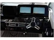 Slide: The Image of 2024 Formula 380 Super Sport Crossover dashboard with dual screens and steering wheel. - 14