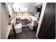 Slide: The Image of 2024 Formula 380 Super Sport Crossover interior with modern seating and dining area. - 19