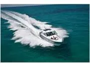 Slide: The Image of 2024 Formula 380 Super Sport Crossover speeding on clear blue ocean waters. - 9