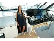 Slide: The Image of 2024 Formula 500 Super Sport Crossover interior with a person standing by the helm. - 21