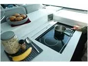 Slide: The Image of 2024 Formula 500 Super Sport Crossover kitchen with stove, pot, and breakfast items. - 40