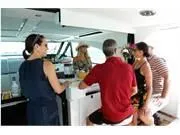 Slide: The Image of People socializing in the cabin of a 2024 Formula 500 Super Sport Crossover yacht. - 42