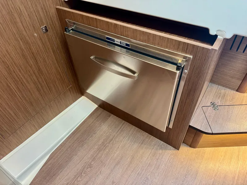 Slide: The Image of 2025 Beneteau Antares 11 interior with built-in stainless steel appliance. - 25