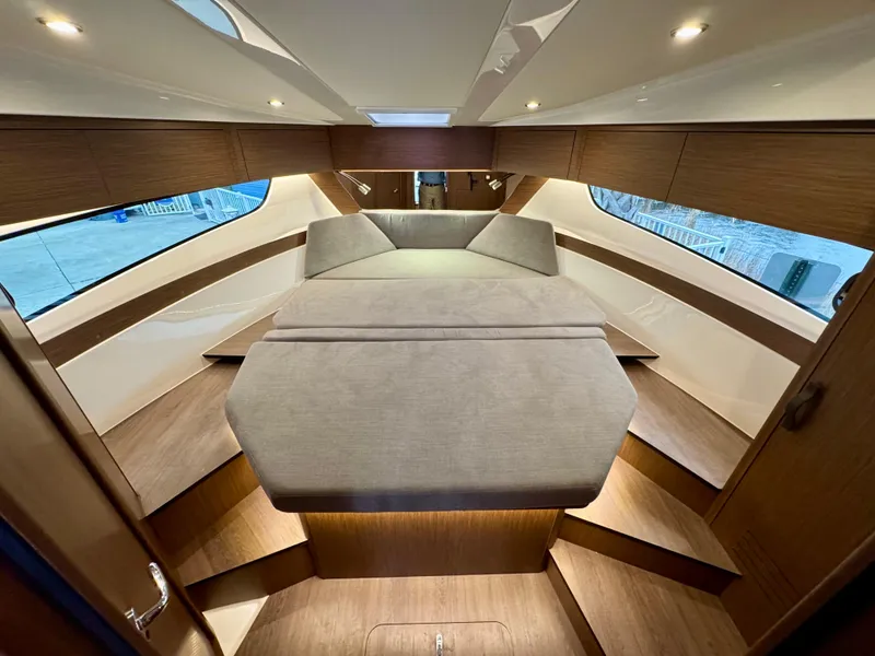 Slide: The Image of Luxurious interior of 2025 Beneteau Antares 11 yacht with elegant wood finishes. - 26