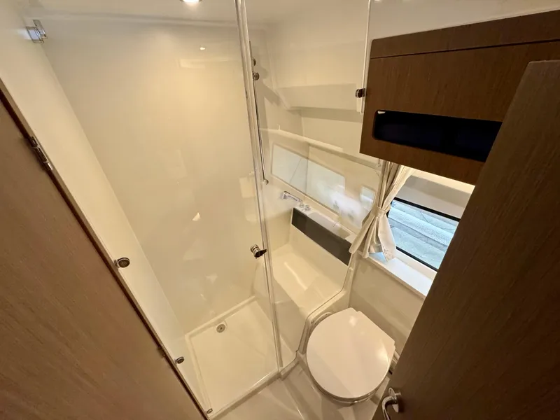 Slide: The Image of Bathroom interior of 2025 Beneteau Antares 11, featuring modern fixtures and compact design. - 29