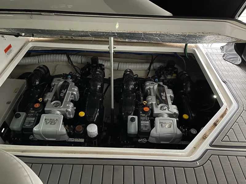 Slide: The Image of 2014 Rinker 360 Express Cruiser engine compartment with dual V8 engines. - 12