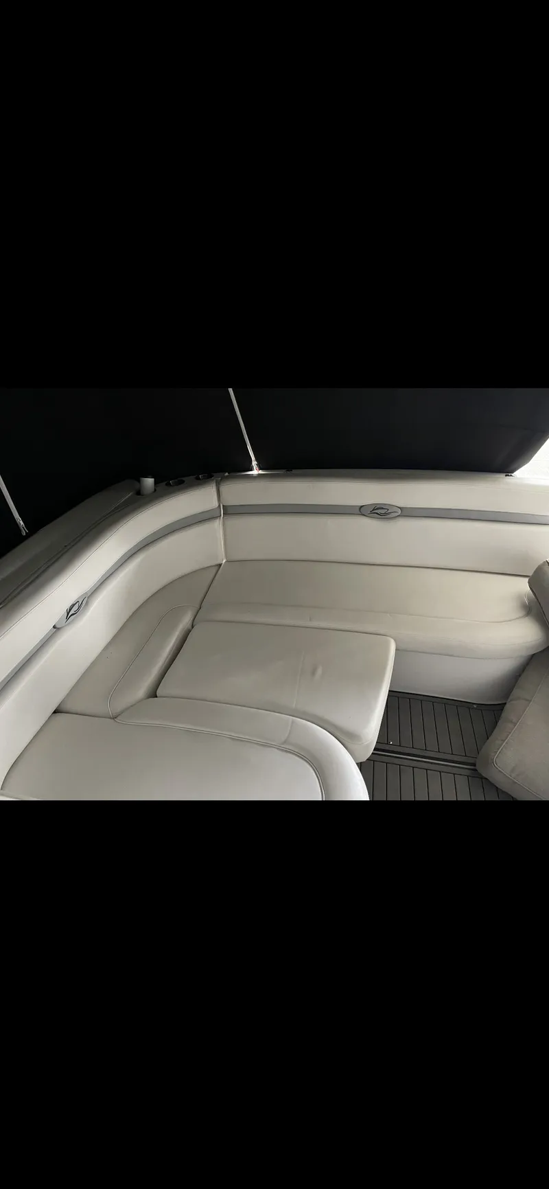 Slide: The Image of 2014 Rinker 360 Express Cruiser interior with white leather seating. - 3