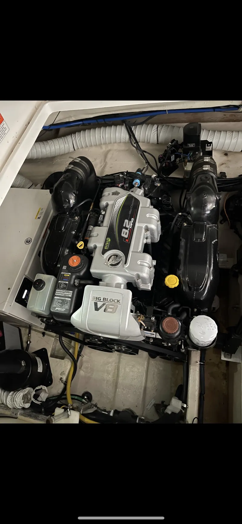 Slide: The Image of Engine compartment of a 2014 Rinker 360 Express Cruiser with a V8 engine. - 5