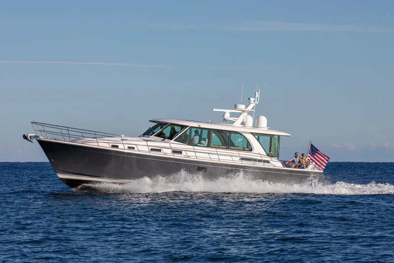 Slide: The Image of 2025 Sabre 58 Salon Express yacht cruising on open water. - 18