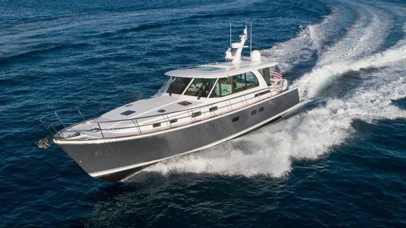 Slide: The Image of 2025 Sabre 58 Salon Express yacht cruising on open water. - 20