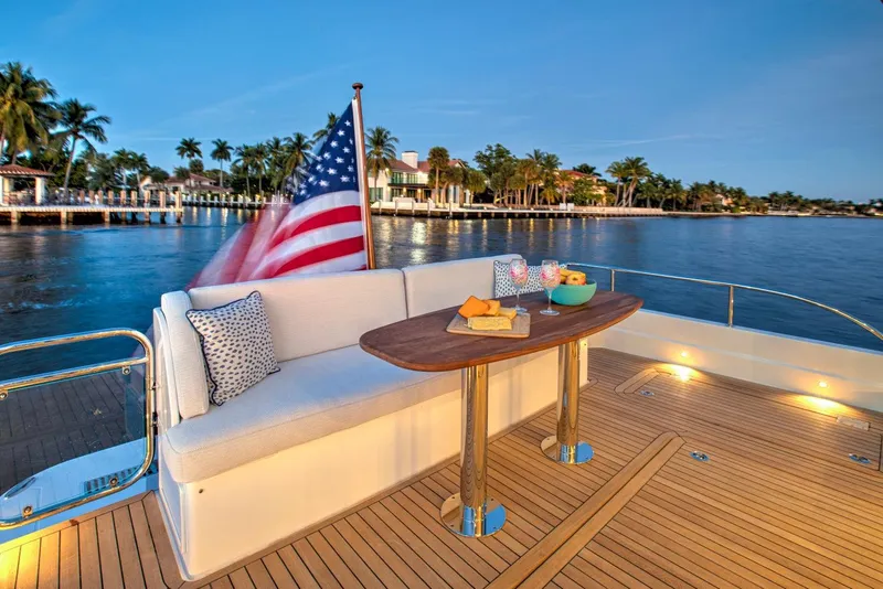 Slide: The Image of Luxury deck of 2025 Sabre 58 Salon Express yacht with American flag. - 4