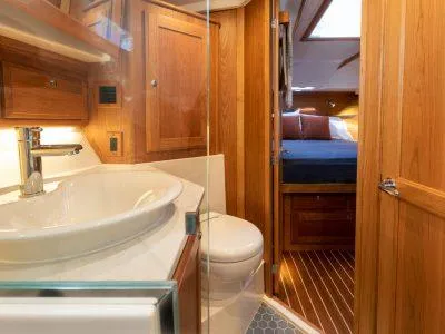 Slide: The Image of 2025 Sabre 43 Salon Express yacht interior bathroom and bedroom - 12